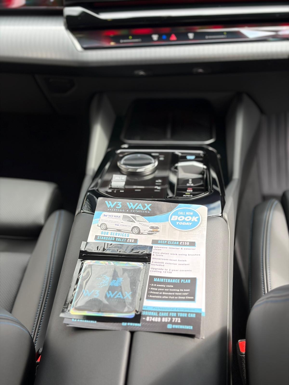 W3 Wax service card in a BMW