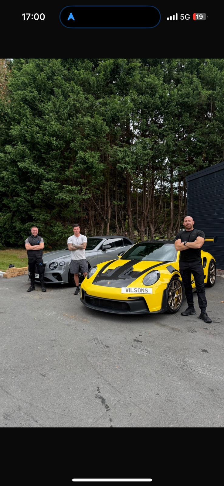 The W3 Wax team with client vehicles